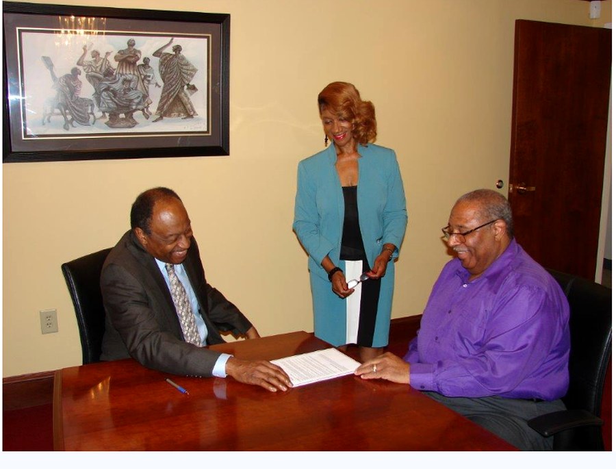 Attorney Edwards with legal assistant and a client at the firm